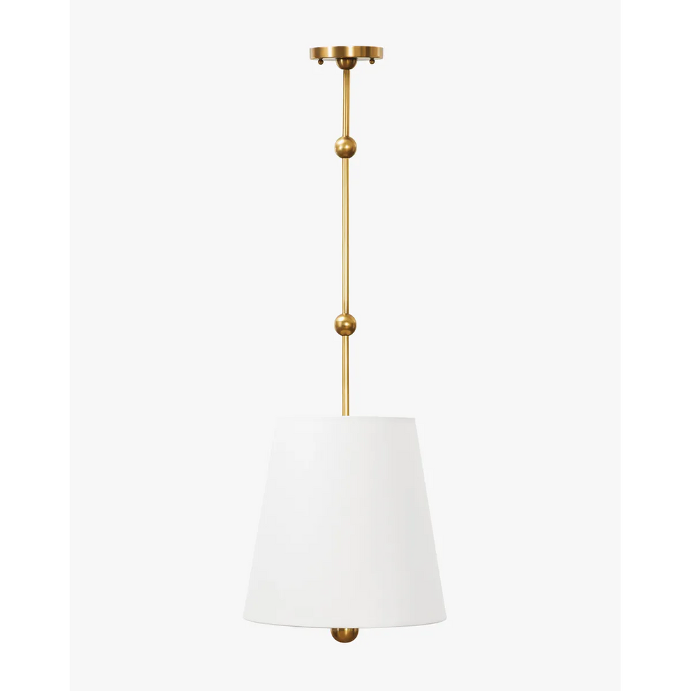Kipling Pendant colonial-inspired antique brass hanging light with rich warm downlight in elegant study interior