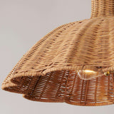handwoven rattan pendant light with aged brass hardware