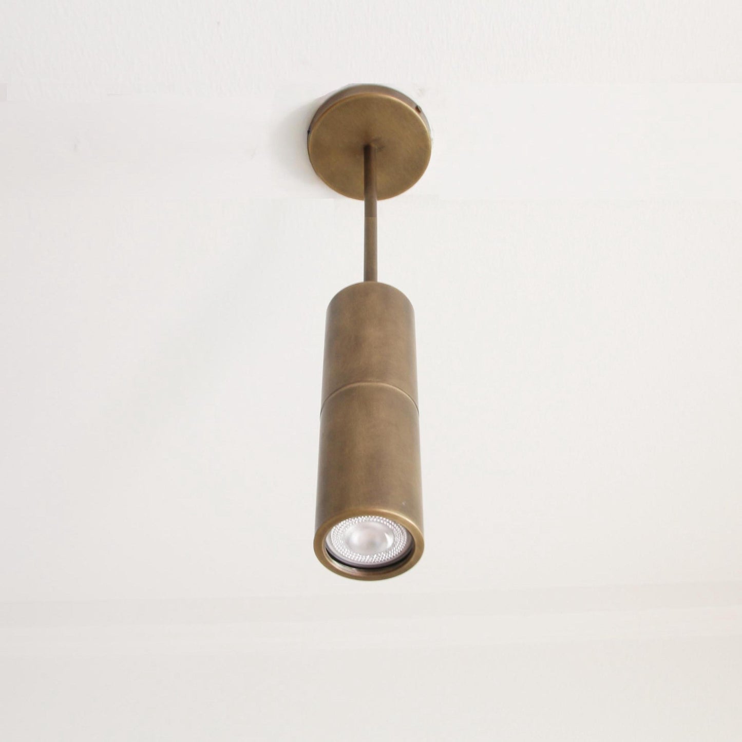 Brass Cylinder Ceiling Spotlight on Drop-Down Arm