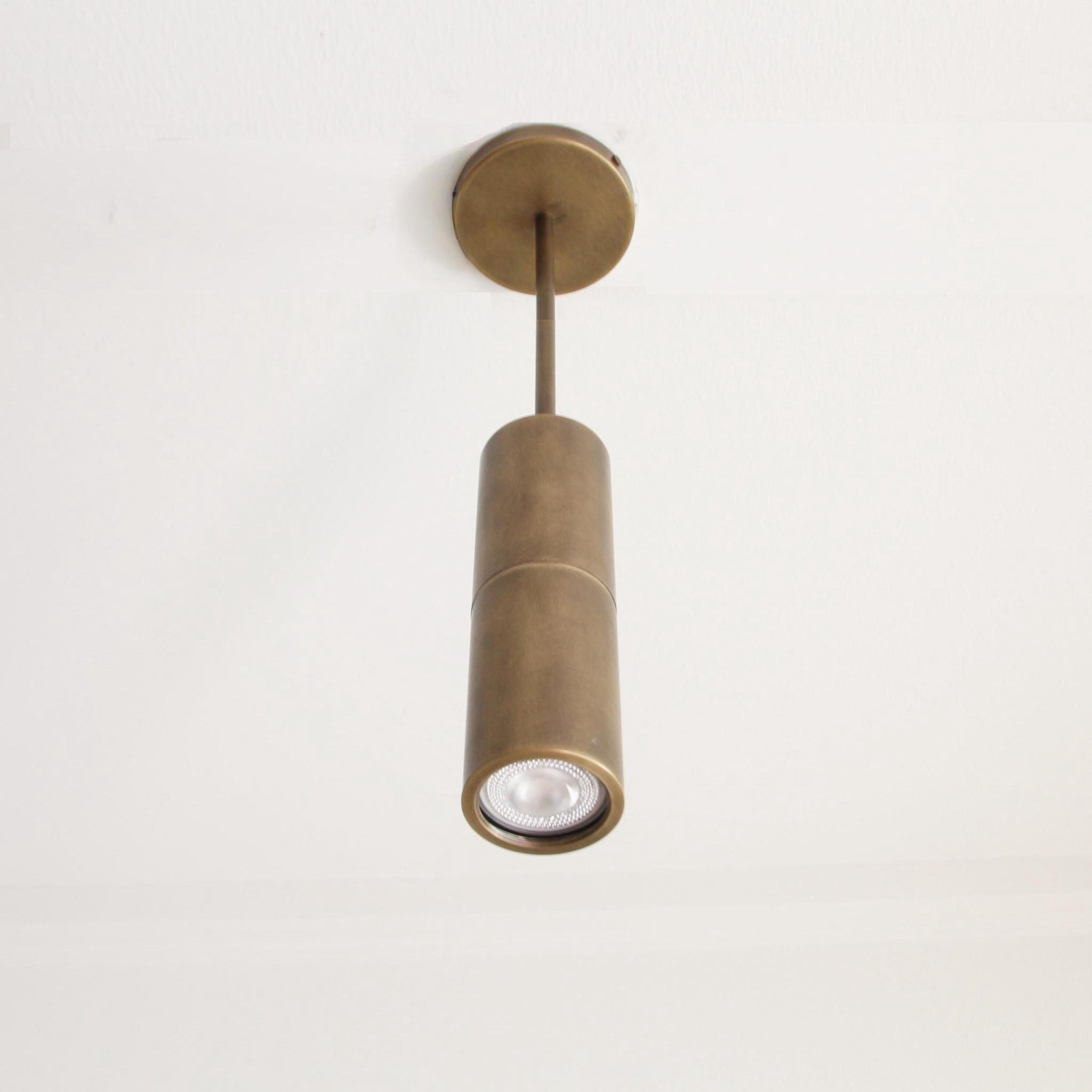 Brass Cylinder Ceiling Spotlight on Drop-Down Arm