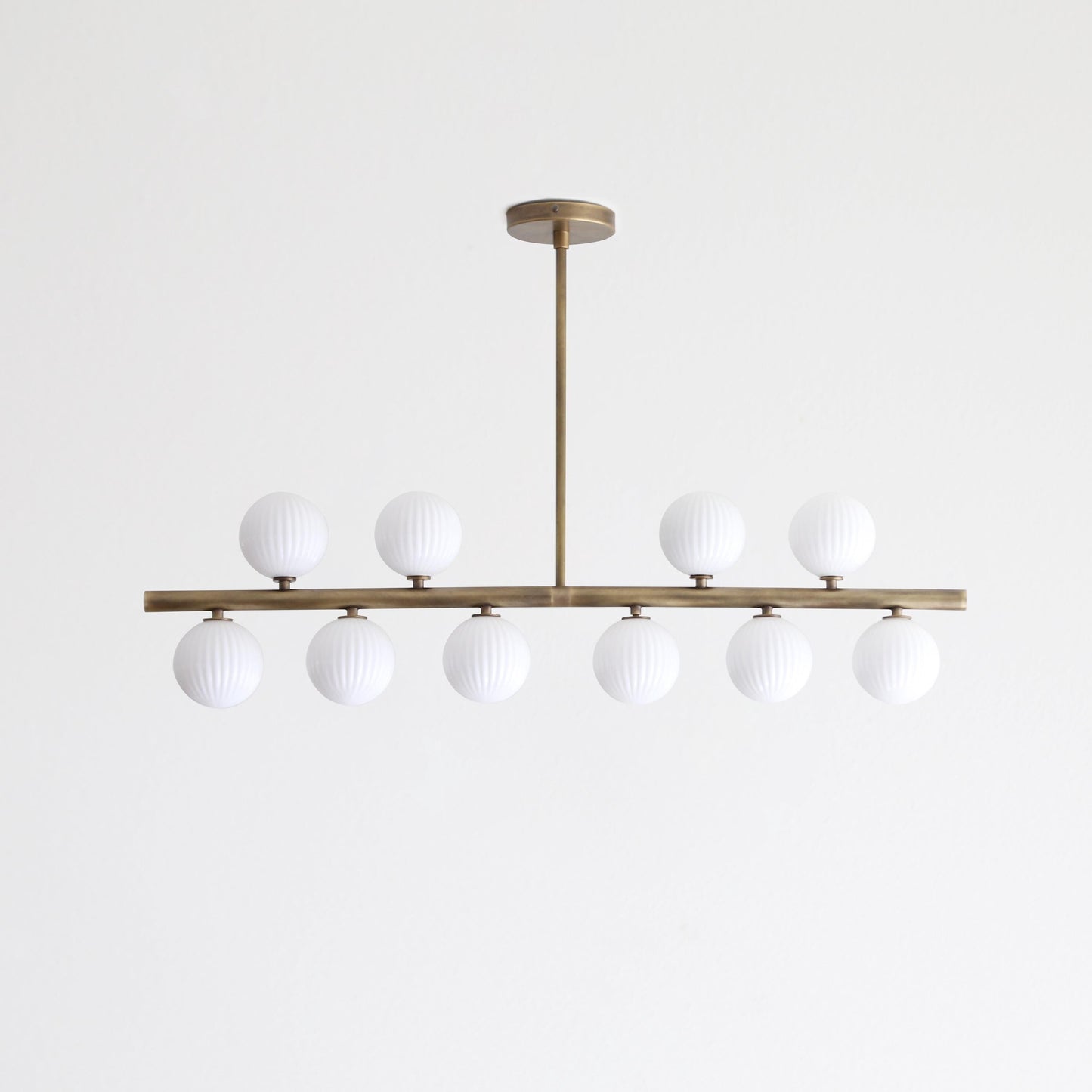 Brass Linear Chandelier with Ribbed Opal Globes