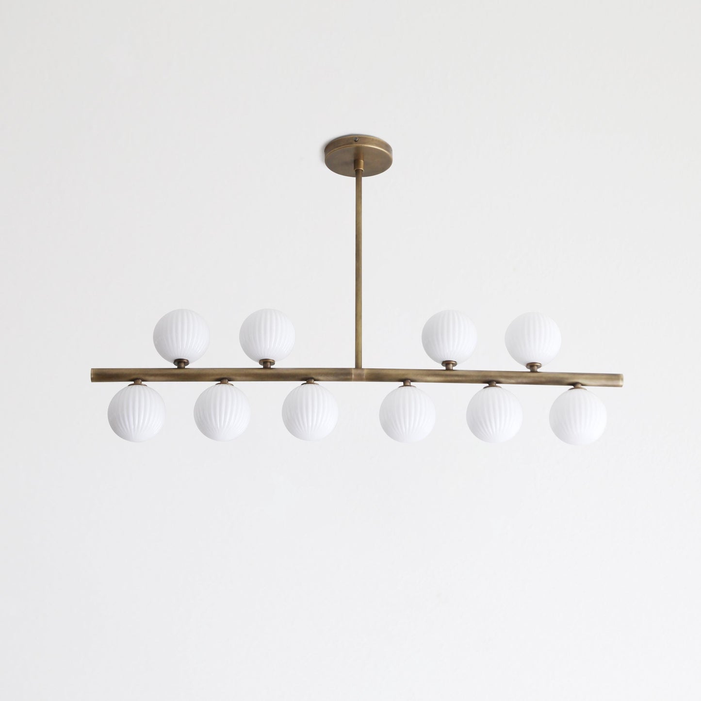 Brass Linear Chandelier with Ribbed Opal Globes