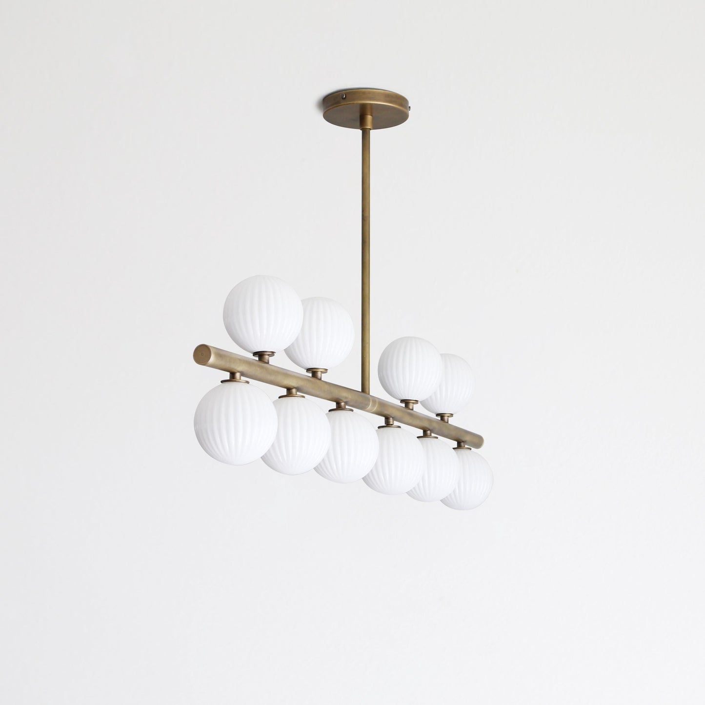 Brass Linear Chandelier with Ribbed Opal Globes