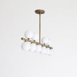 Brass Linear Chandelier with Ribbed Opal Globes