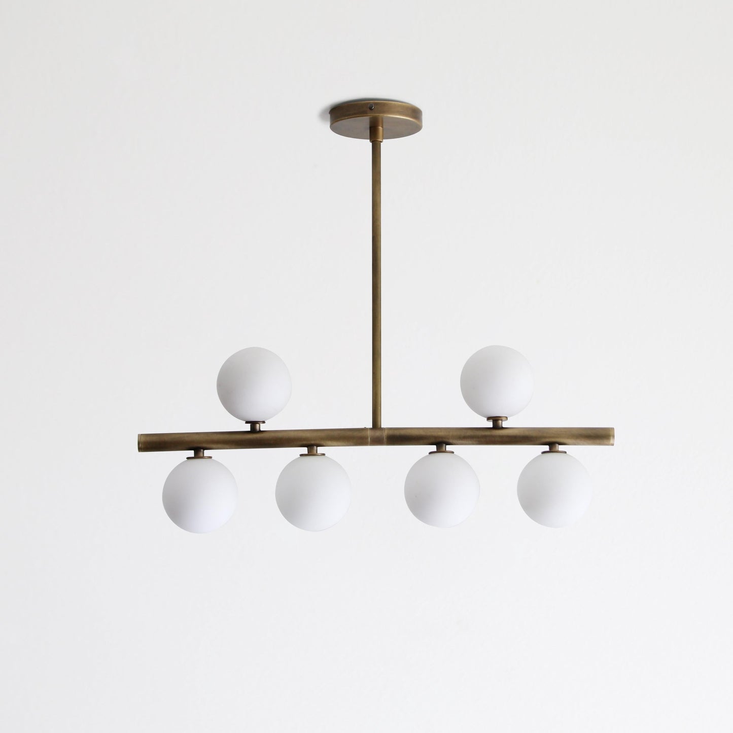 Brass Linear Chandelier with Ribbed Opal Globes