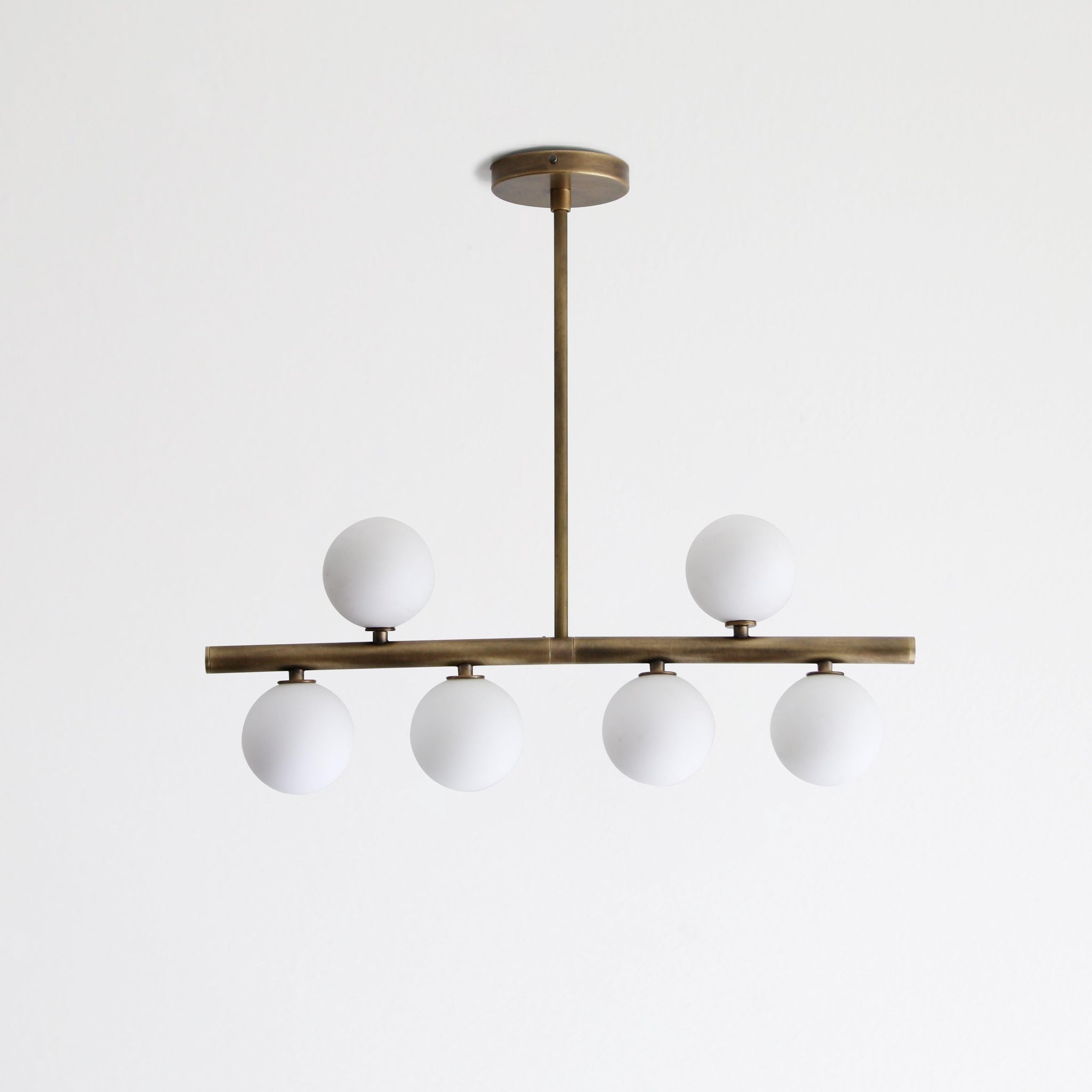Brass Linear Chandelier with Ribbed Opal Globes