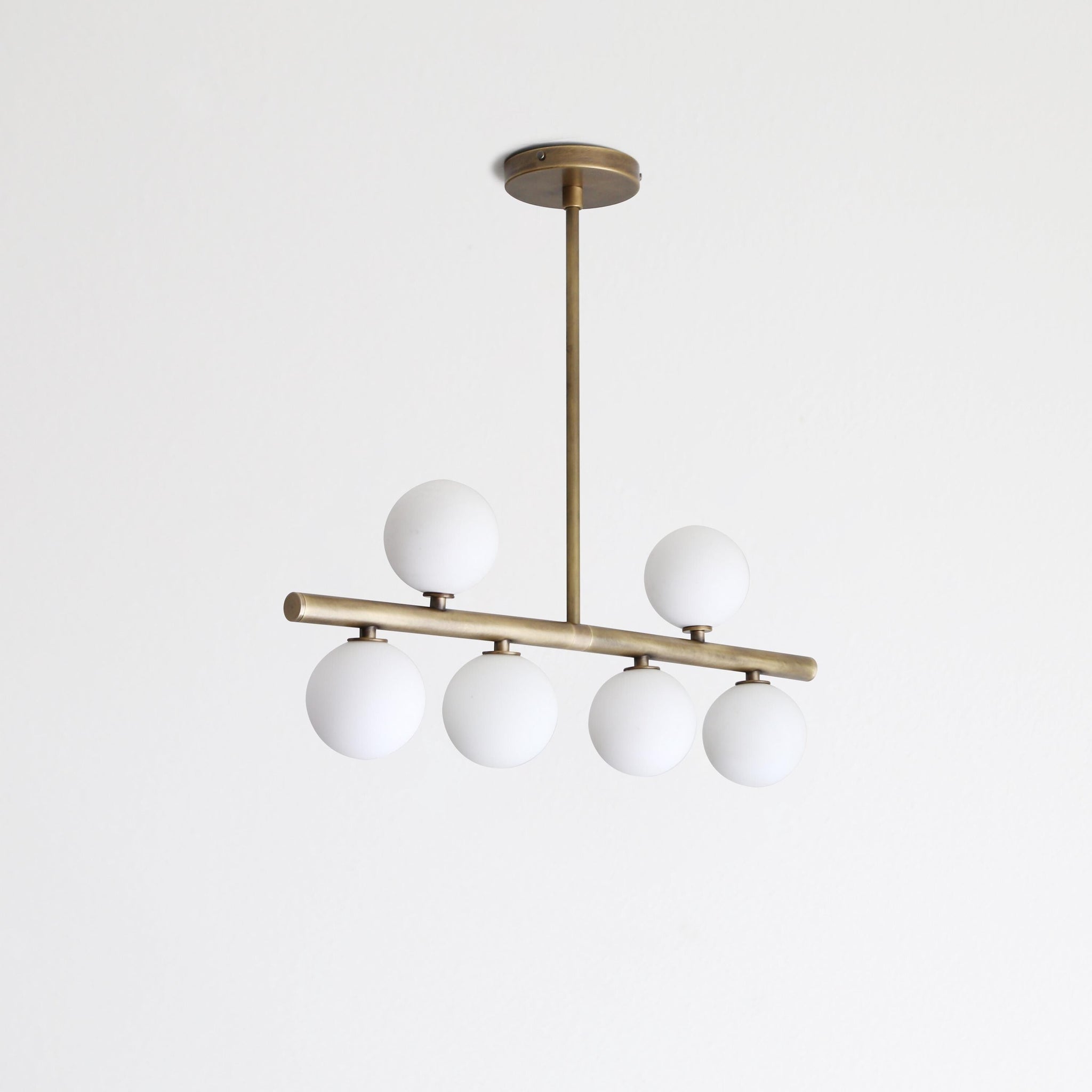 Brass Linear Chandelier with Ribbed Opal Globes