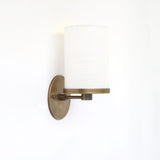 Brass Wall Sconce with Off-White Linen Drum Shade
