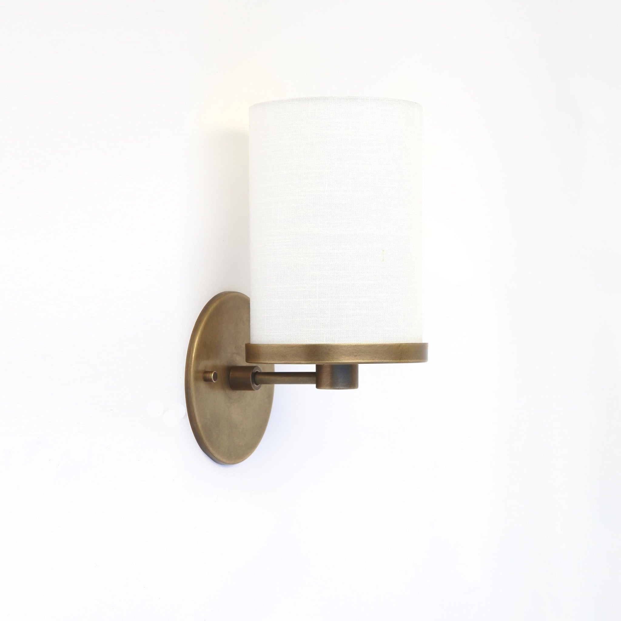 Brass Wall Sconce with Off-White Linen Drum Shade