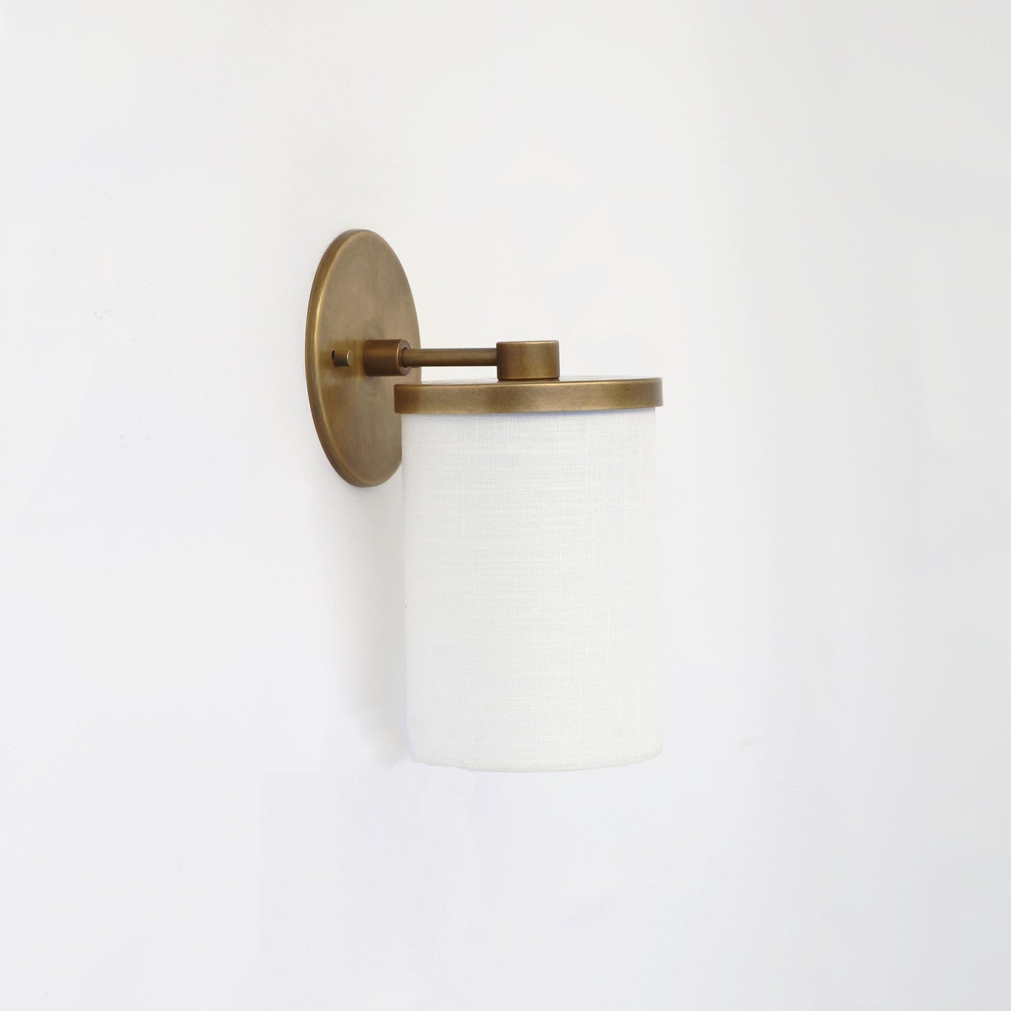 Brass Wall Sconce with Off-White Linen Drum Shade