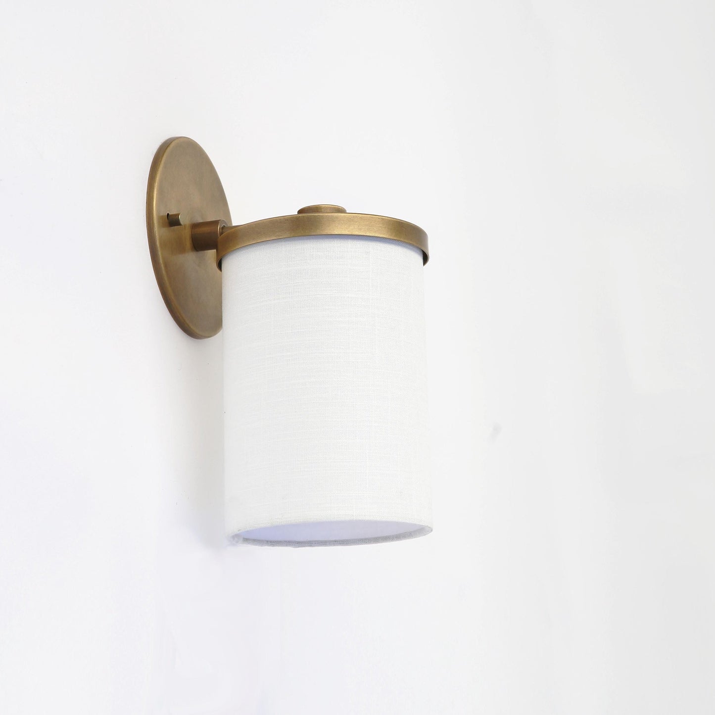 Brass Wall Sconce with Off-White Linen Drum Shade