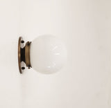 globe shade brass sconce