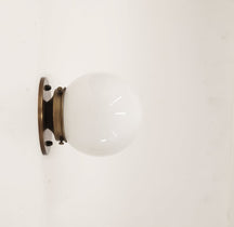globe shade brass sconce