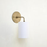 Curved Arm Brass Wall Sconce with Linen Drum Shade