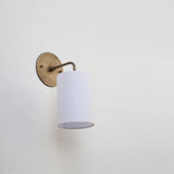 Curved Arm Brass Wall Sconce with Linen Drum Shade