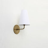 Curved Arm Brass Wall Sconce with Tapered Linen Shade