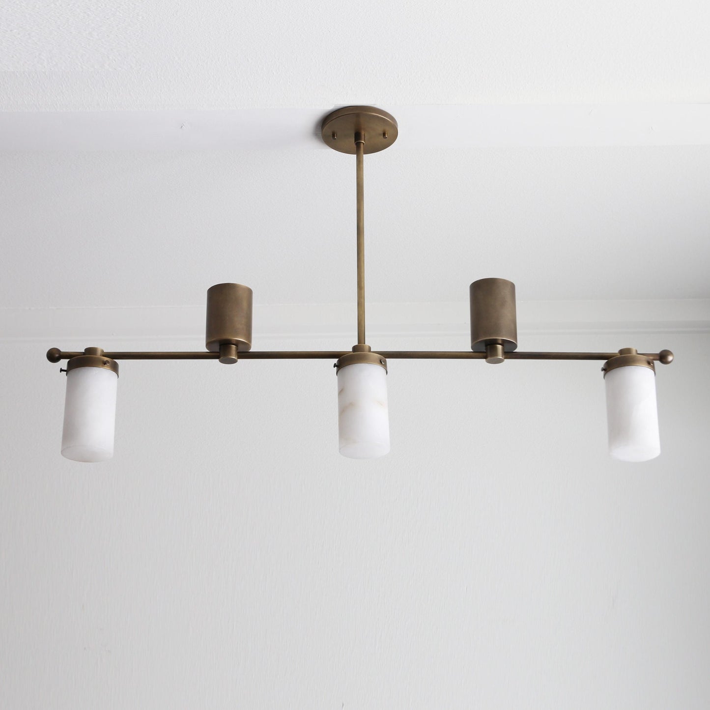 Five-Light Linear Brass Chandelier with Cylinder Shades