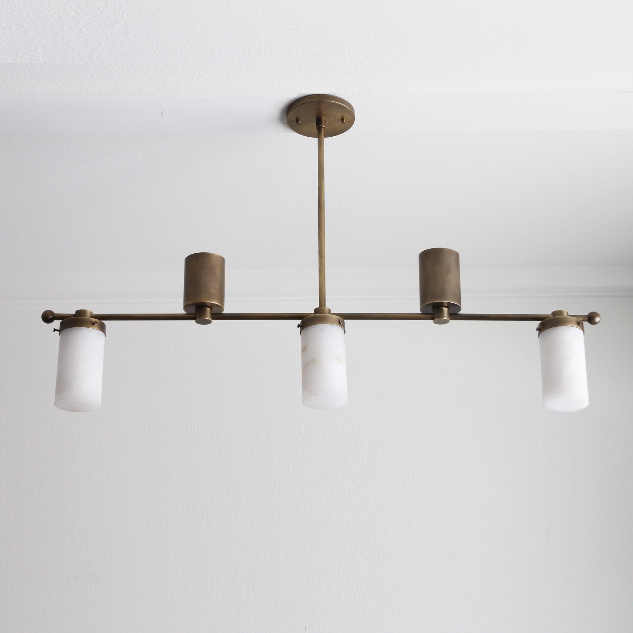 Five-Light Linear Brass Chandelier with Cylinder Shades