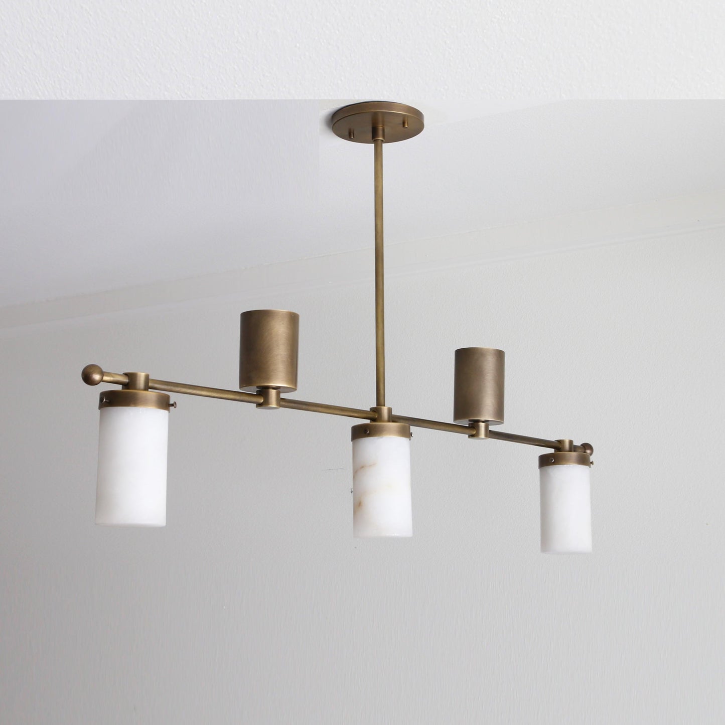Five-Light Linear Brass Chandelier with Cylinder Shades