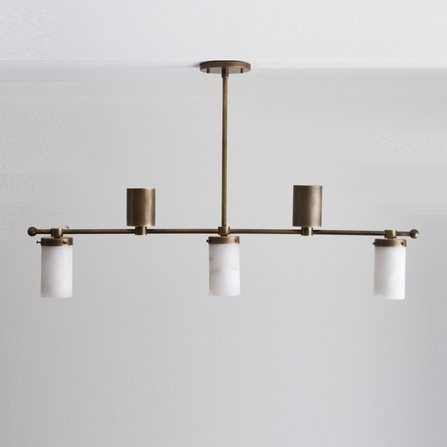 Five-Light Linear Brass Chandelier with Cylinder Shades