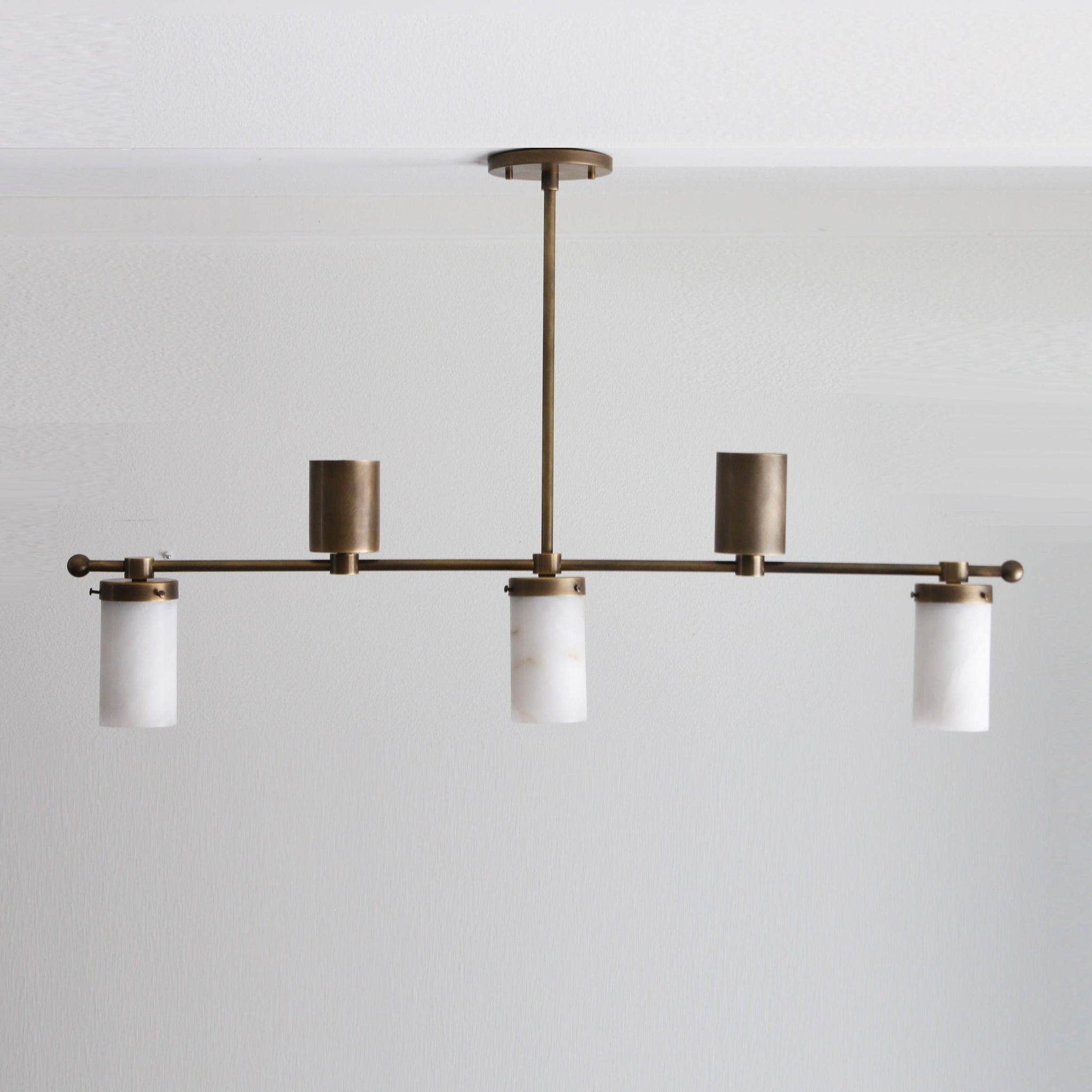 Five-Light Linear Brass Chandelier with Cylinder Shades