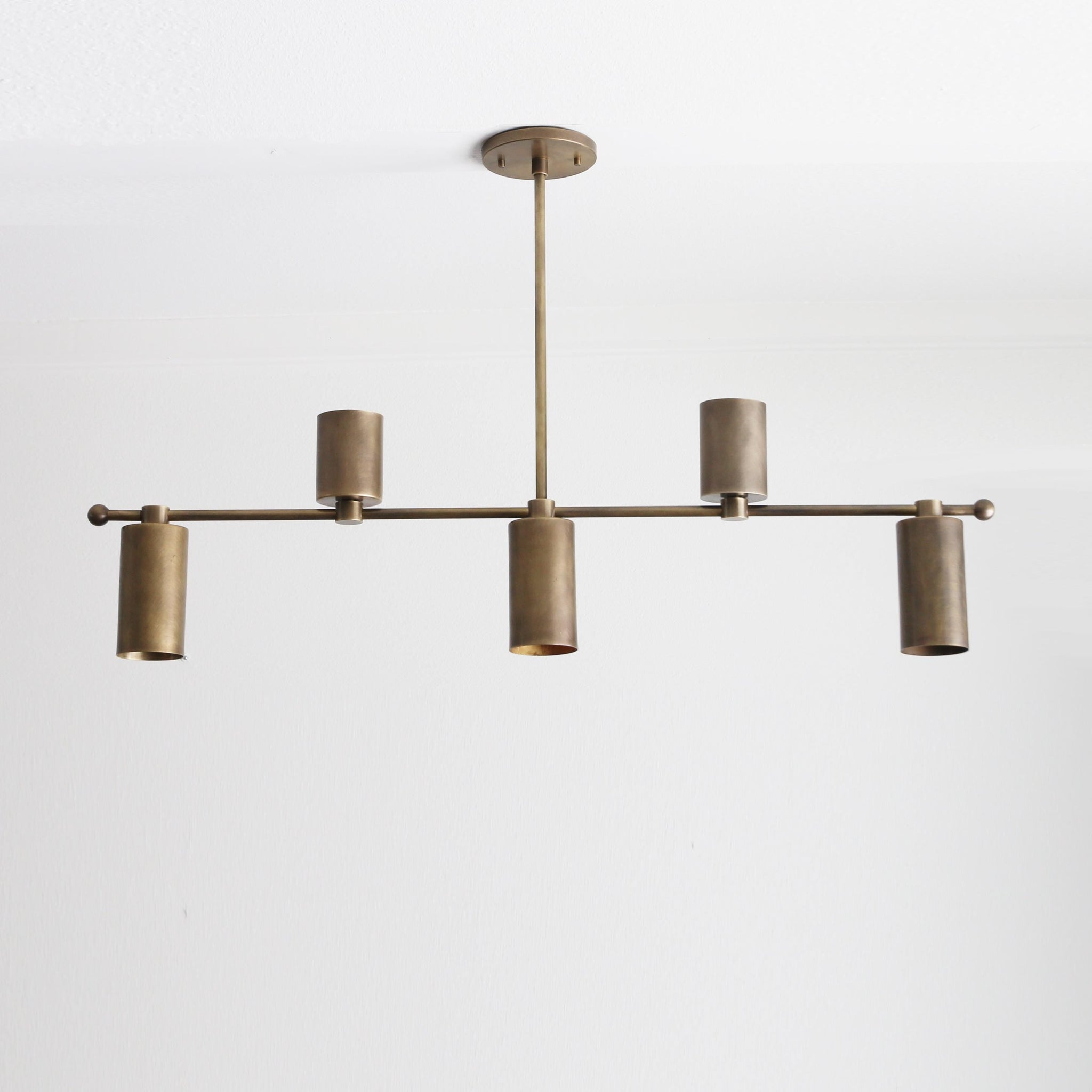 Five-Light Linear Brass Chandelier with Cylinder Shades