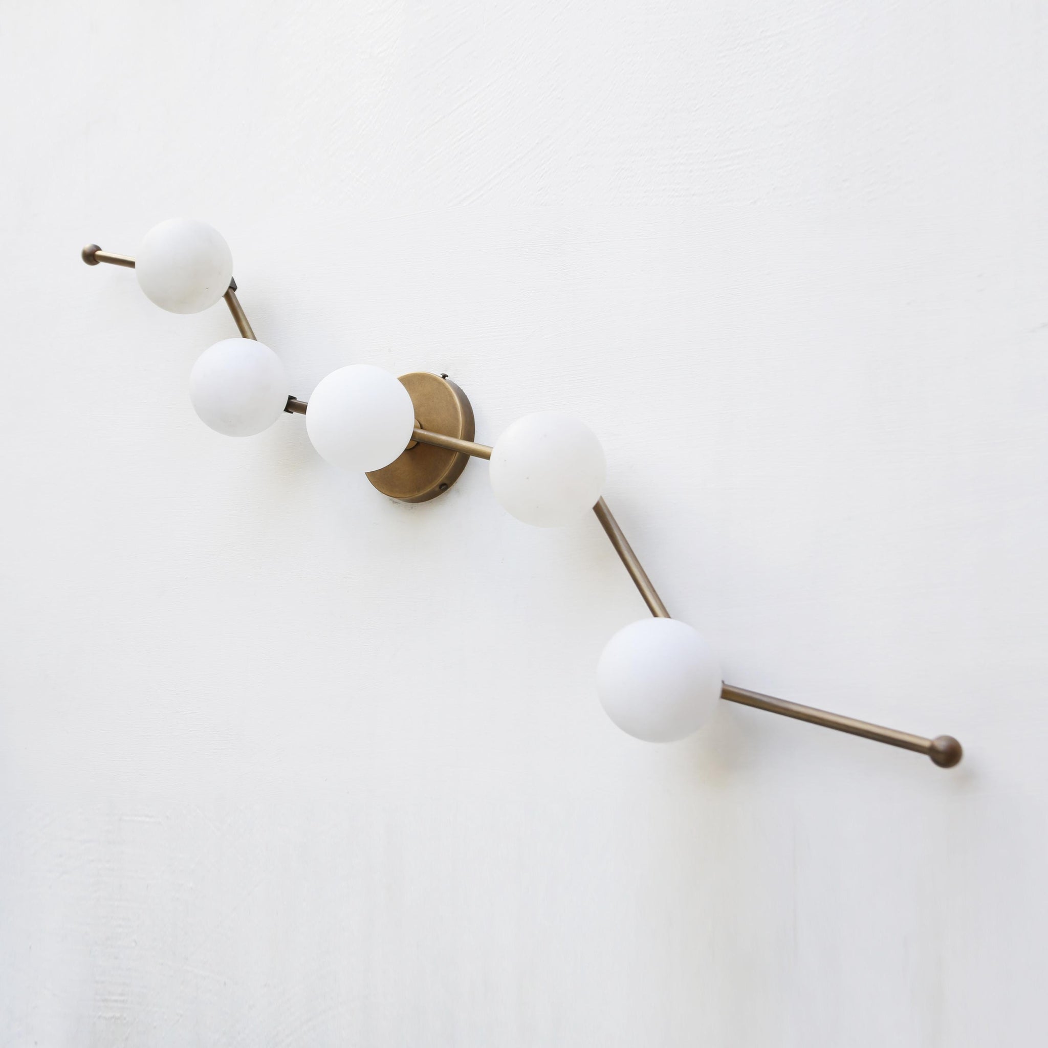 Five-Light Staggered Brass Bar Sconce with Opal Glass Globes