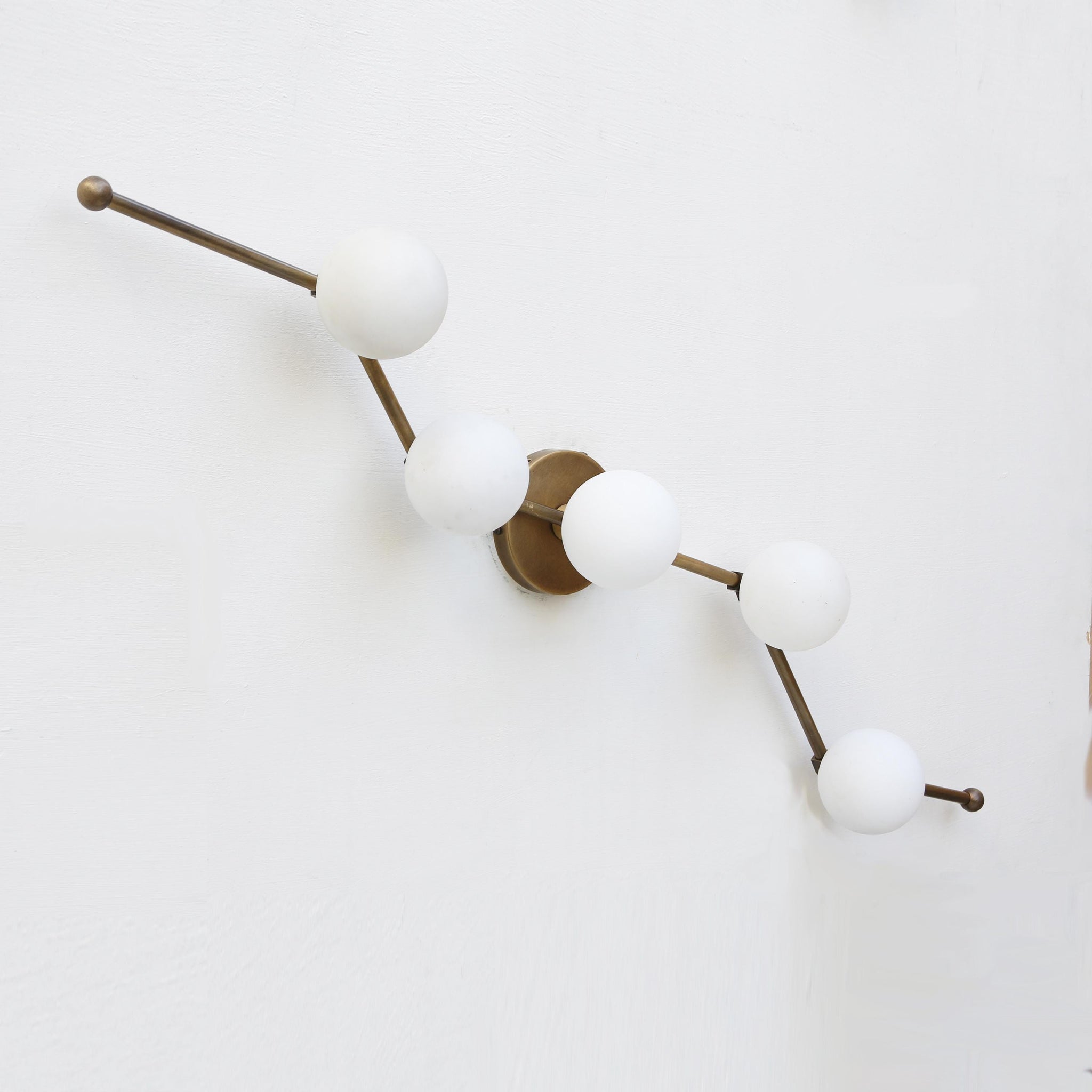 Five-Light Staggered Brass Bar Sconce with Opal Glass Globes