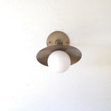 One-Light Adjustable Brass Saucer Wall Sconce with Opal Globe