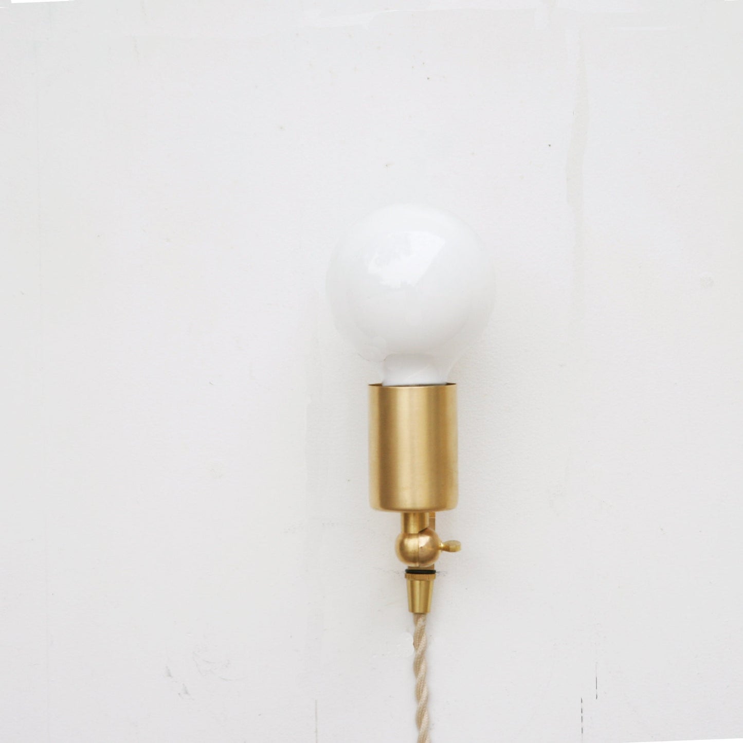 One-Light Adjustable Plug-In Wall Sconce with Exposed Bulb