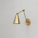 One-Light Adjustable Swing Arm Wall Sconce with Large Brass Cone