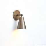 One-Light Adjustable Wall Sconce with Large Brass Cone