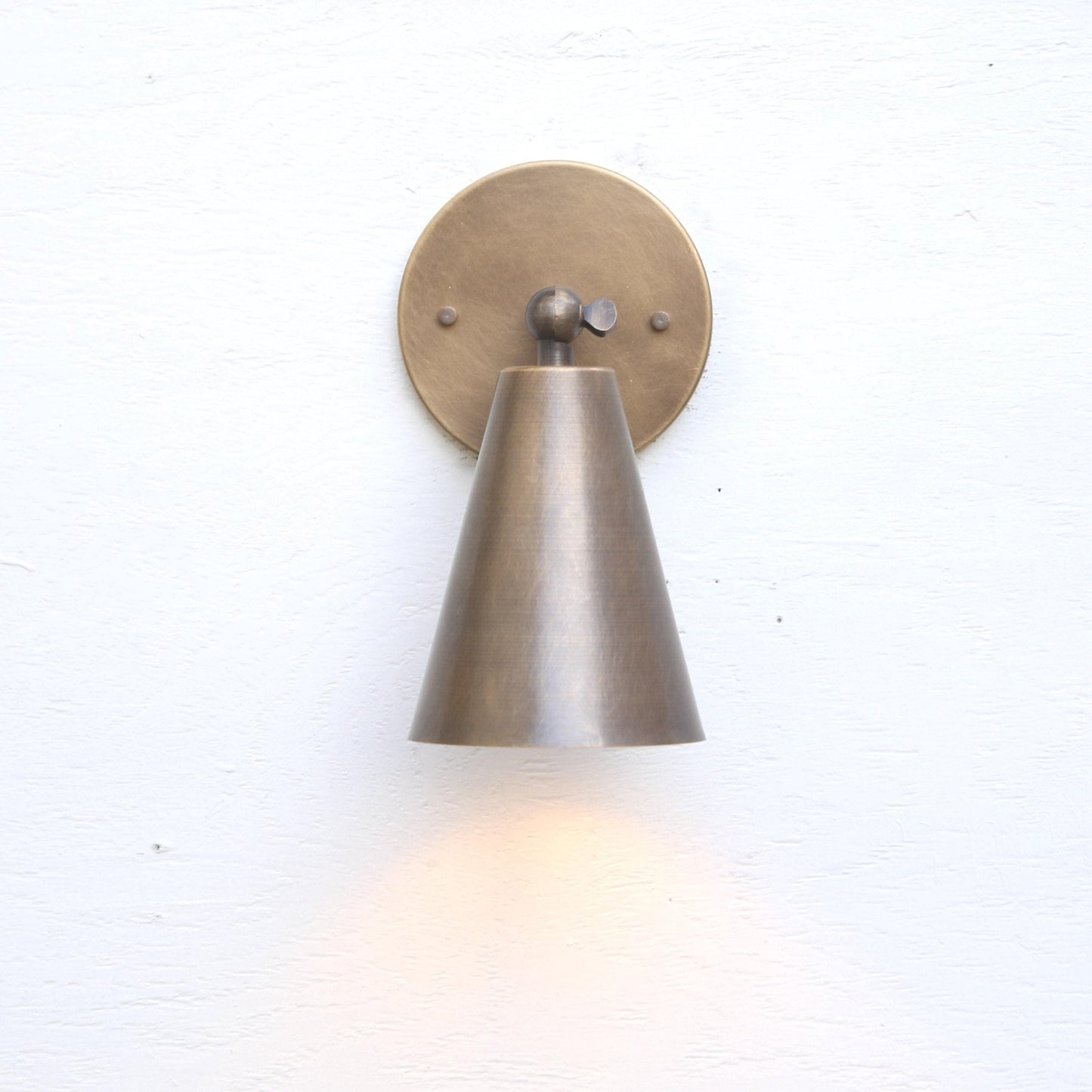 One-Light Adjustable Wall Sconce with Large Brass Cone