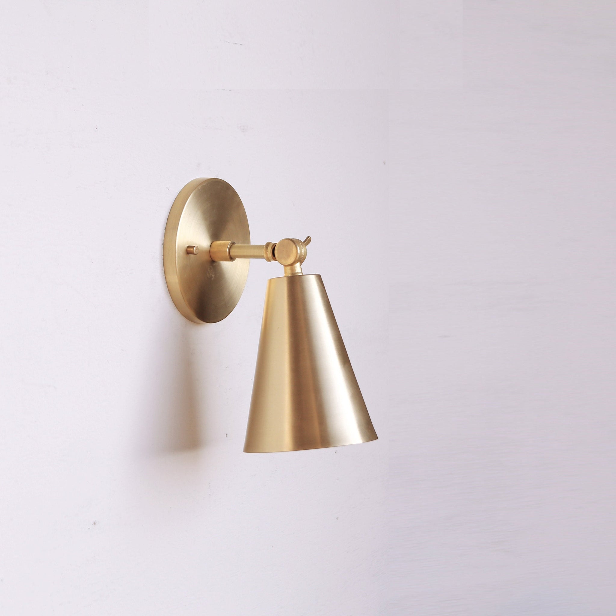 One-Light Adjustable Wall Sconce with Large Brass Cone