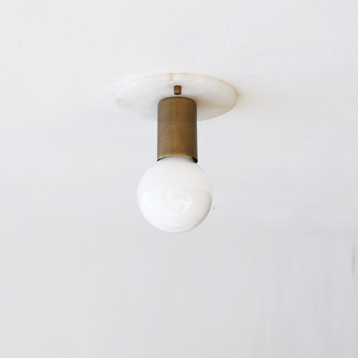 One-Light Alabaster Back Plate Sconce with Exposed Bulb