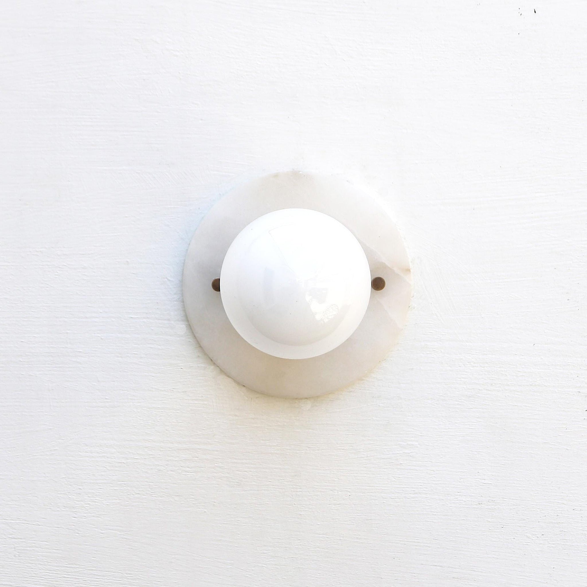 One-Light Alabaster Back Plate Sconce with Exposed Bulb