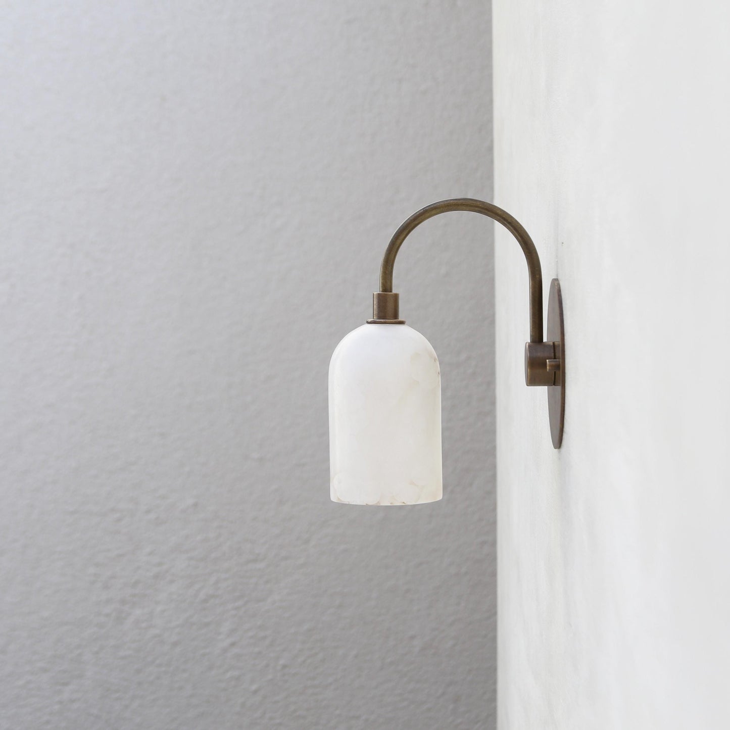 One-Light Alabaster Shade Curved Arm Wall Sconce