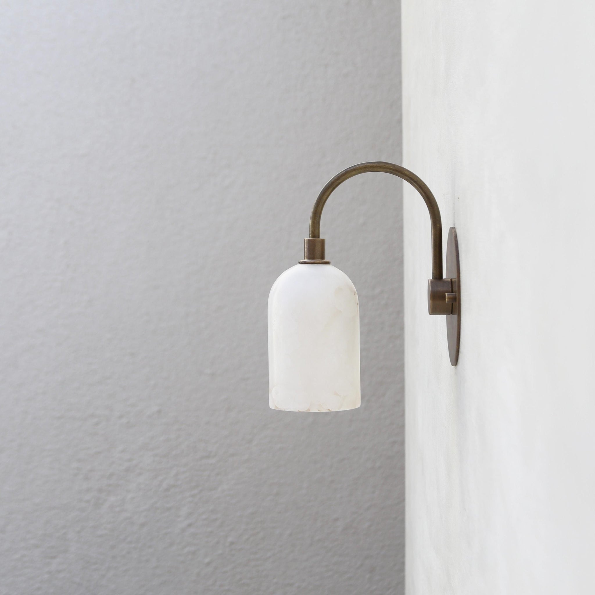 One-Light Alabaster Shade Curved Arm Wall Sconce