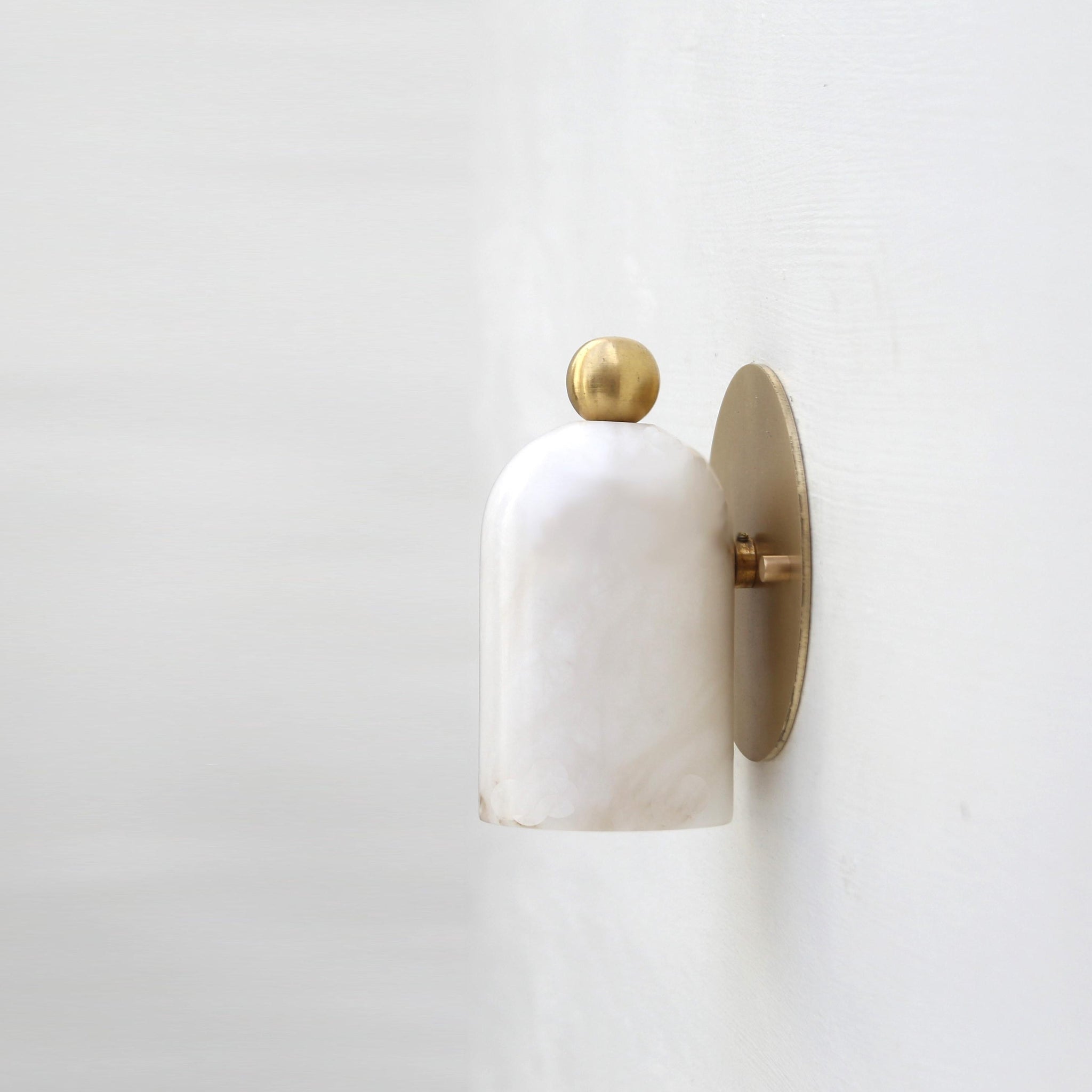 One-Light Alabaster Wall Sconce with Round Brass Backplate