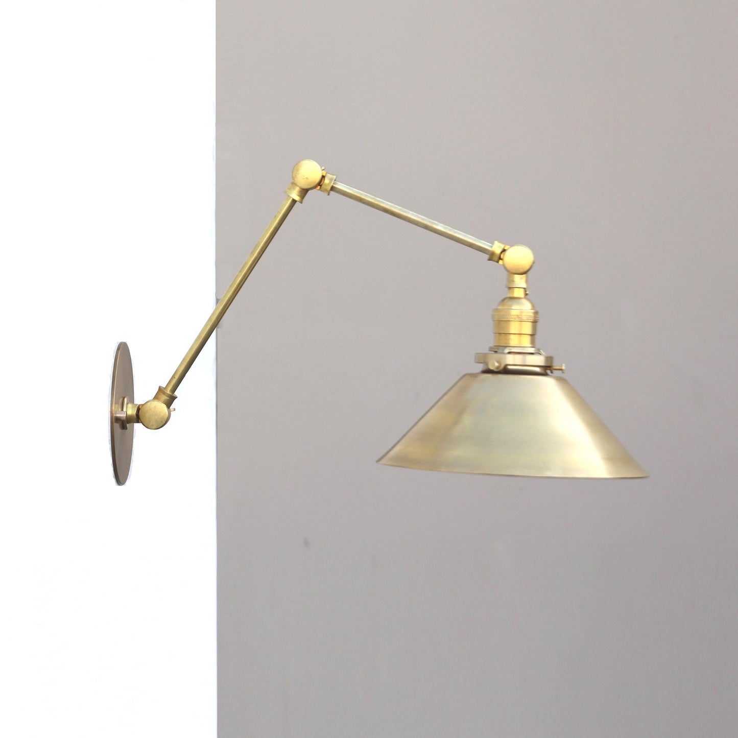 One-Light Articulating Brass Swing Arm Wall Sconce with Cone Shade