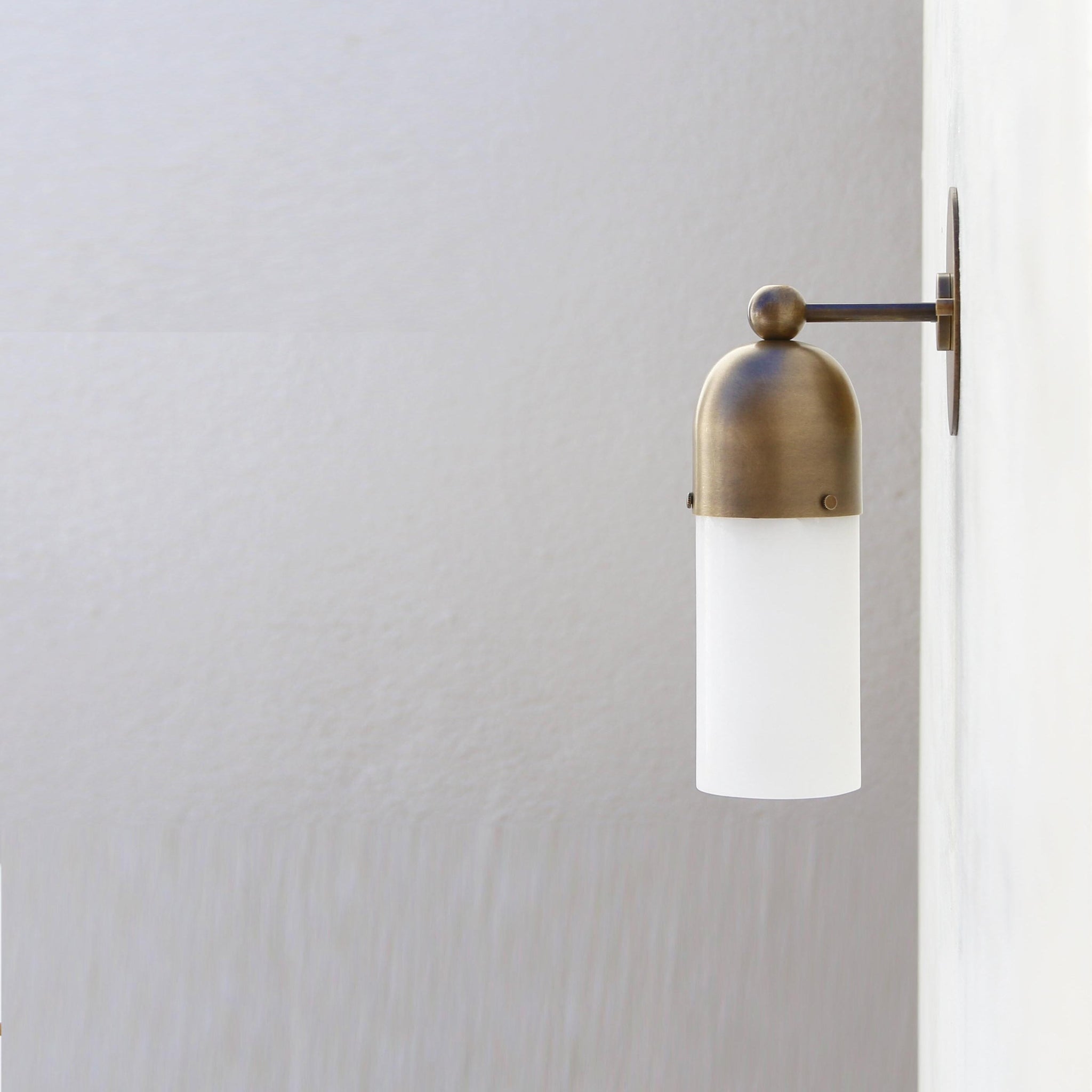 One-Light Brass Cap Wall Sconce with Frosted Glass Tube