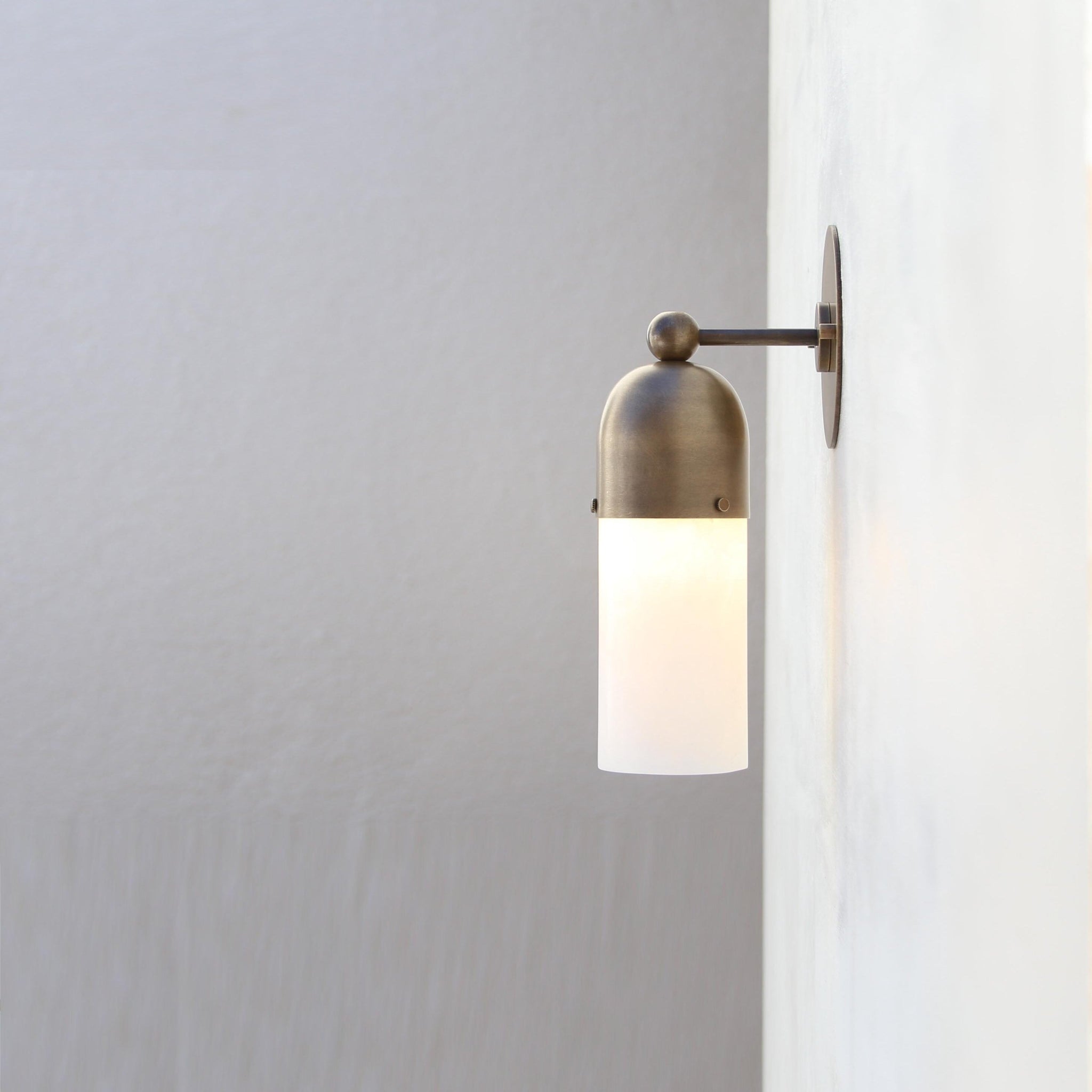 One-Light Brass Cap Wall Sconce with Frosted Glass Tube