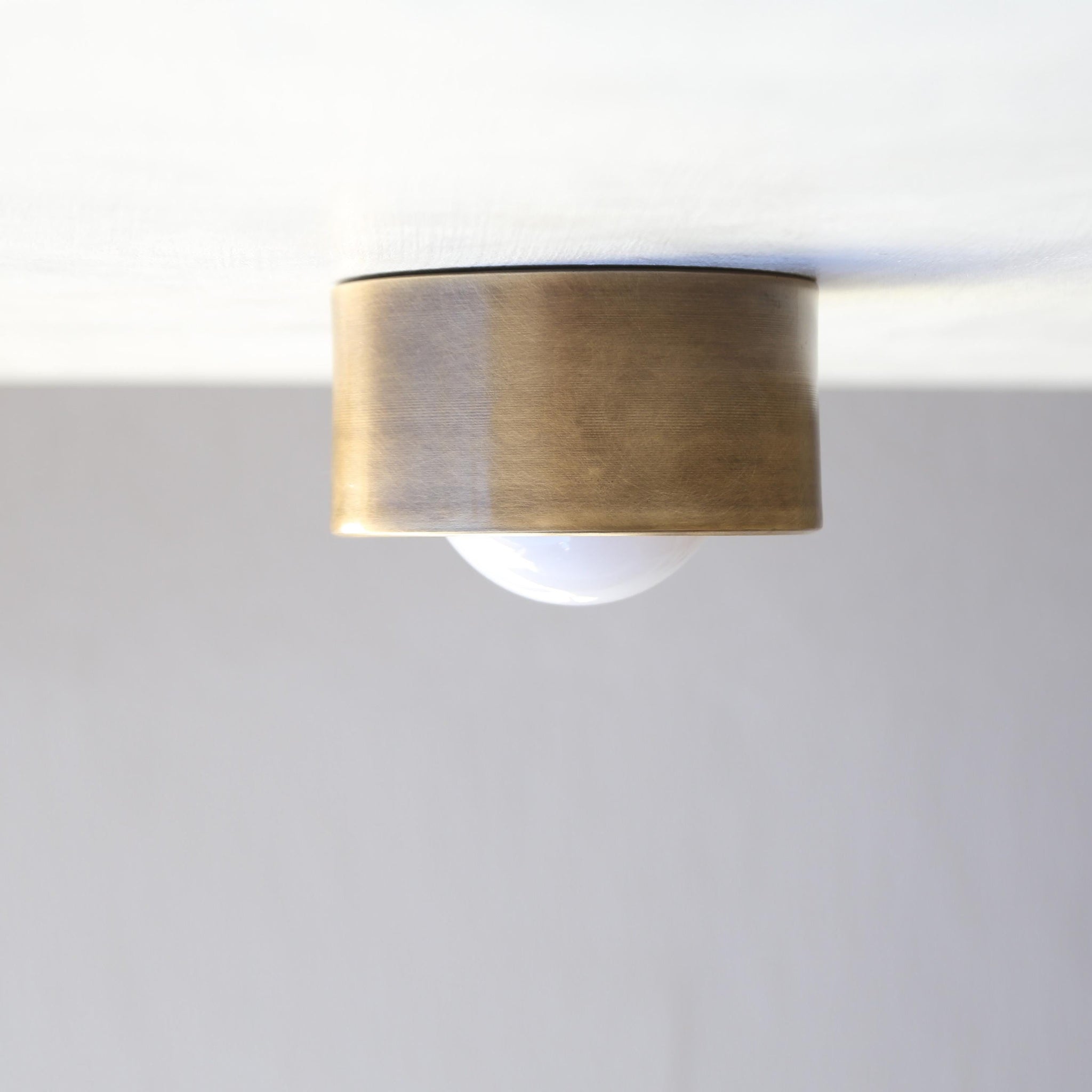 One-Light Brass Cylinder Flush Mount with Opal Glass Globe