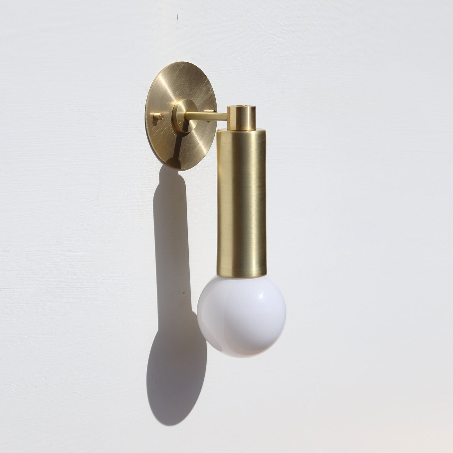 One-Light Brass Cylinder Wall Sconce with Exposed Bulb