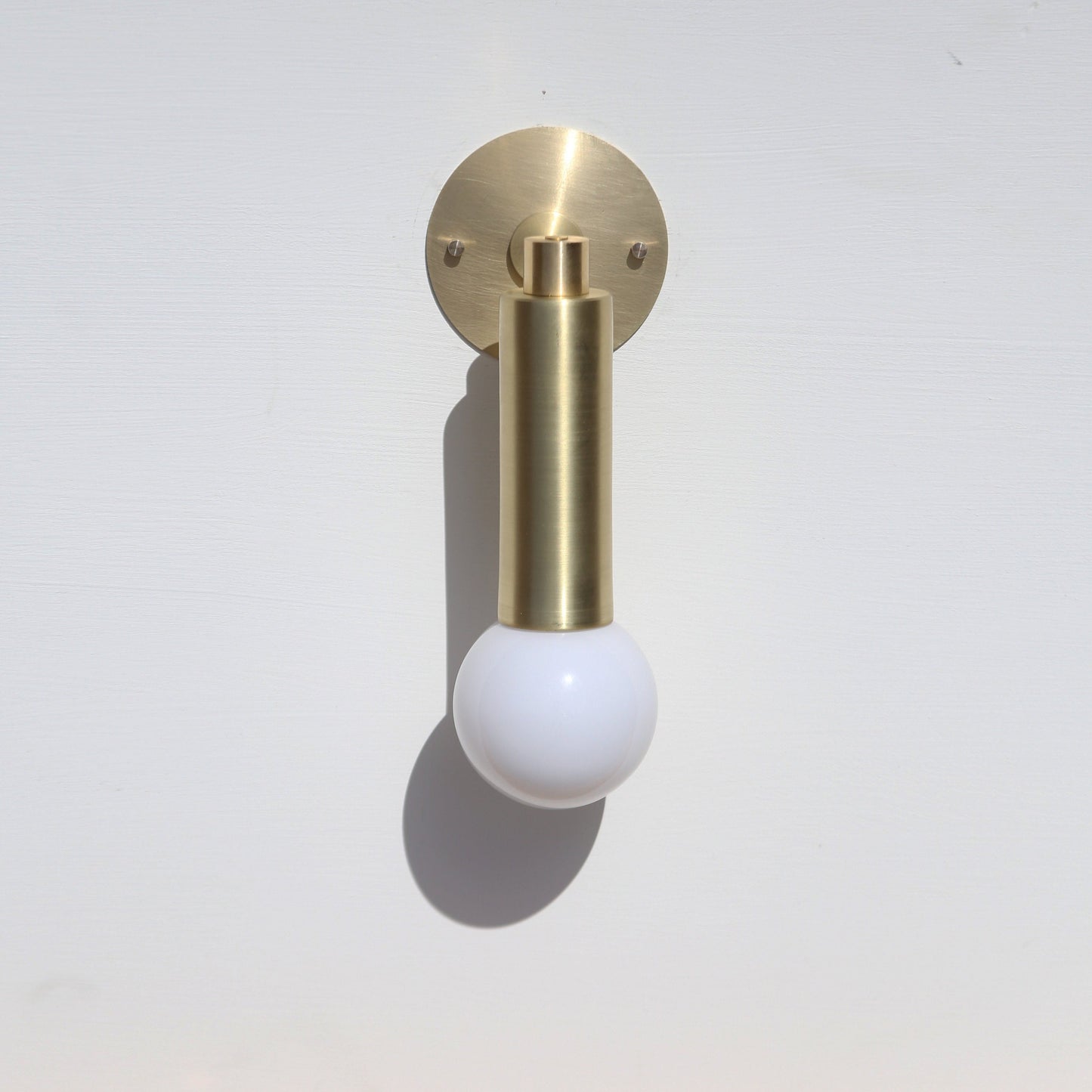 One-Light Brass Cylinder Wall Sconce with Exposed Bulb