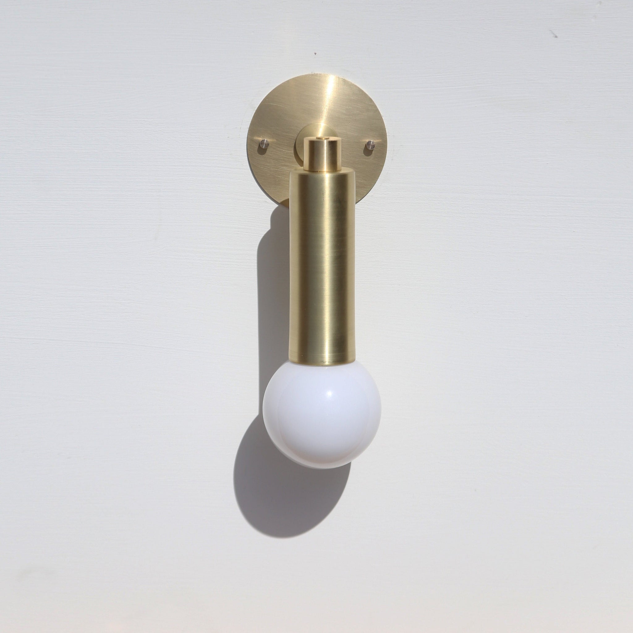 One-Light Brass Cylinder Wall Sconce with Exposed Bulb
