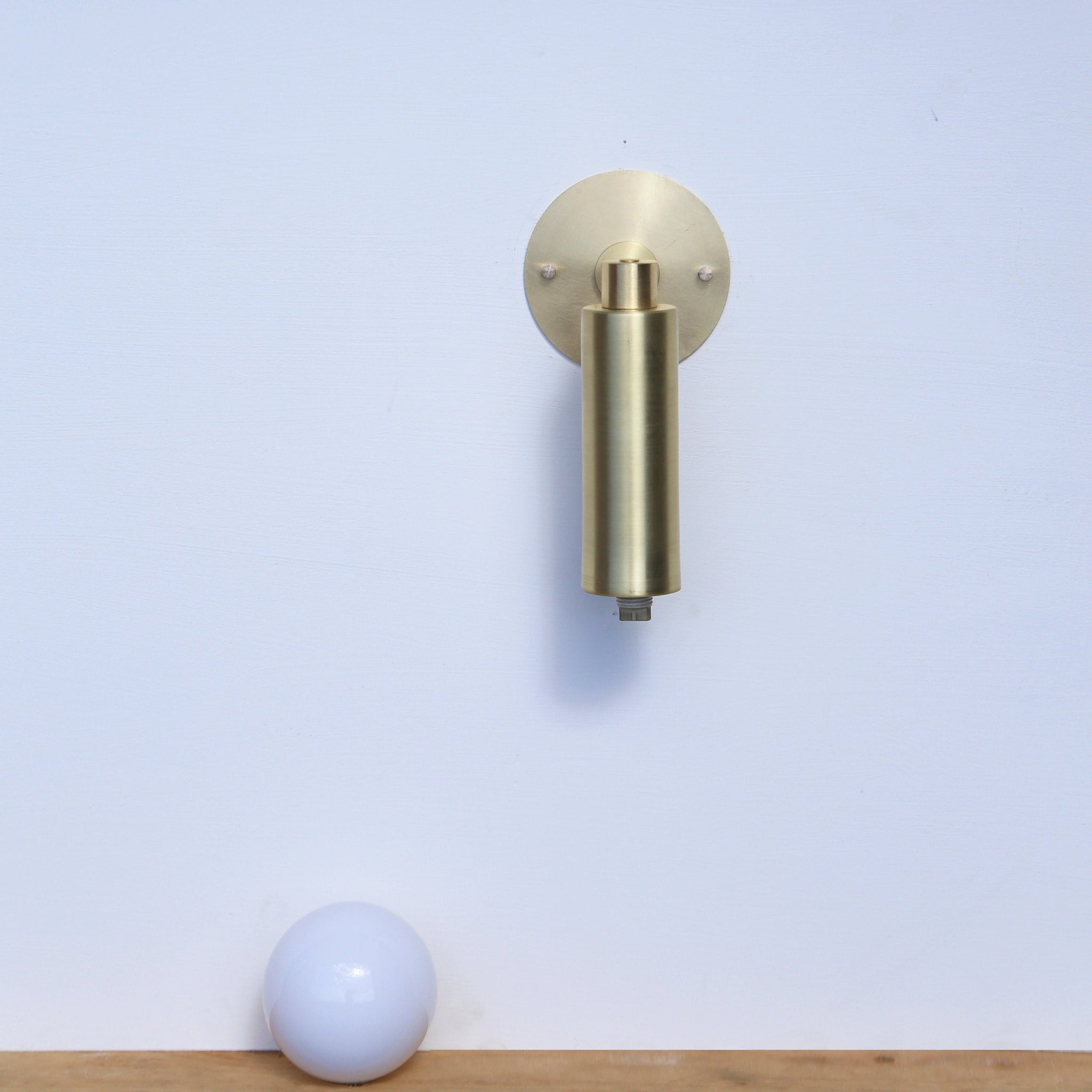 One-Light Brass Cylinder Wall Sconce with Exposed Bulb
