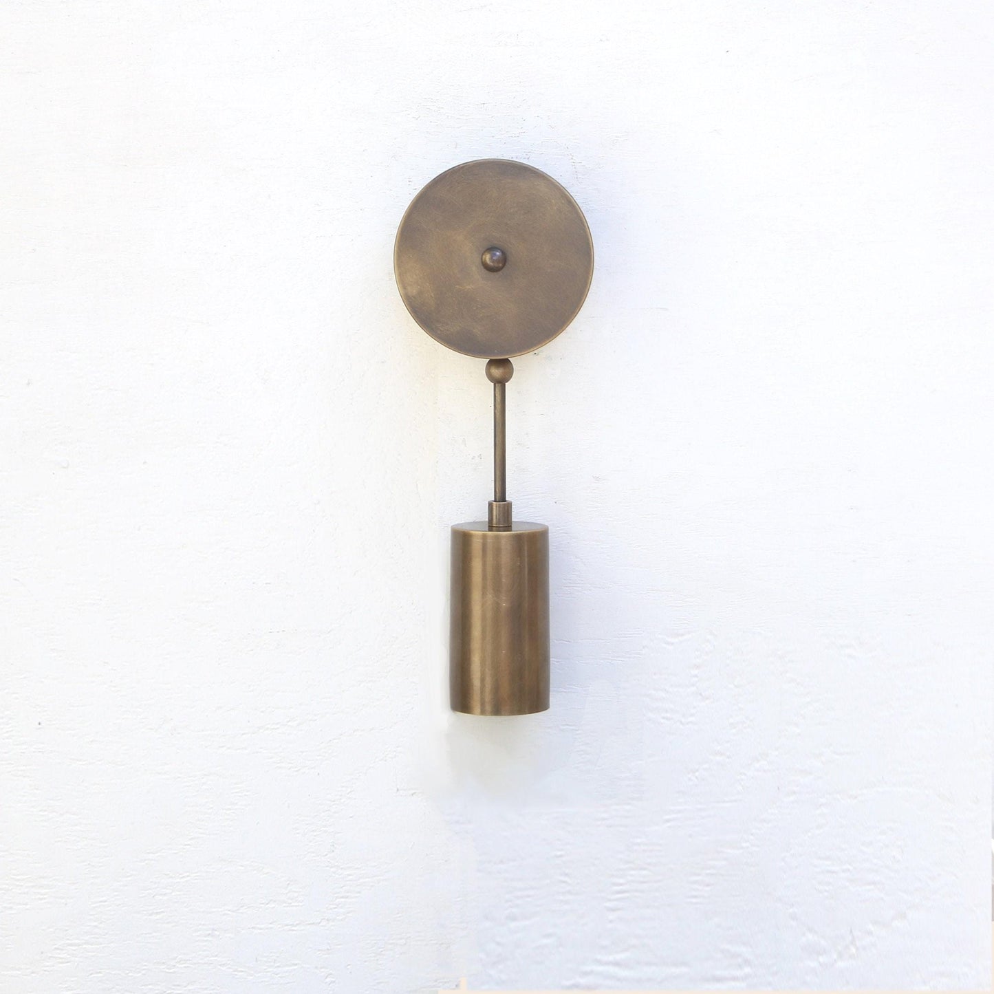 One-Light Brass Cylinder Wall Sconce with Round Backplate