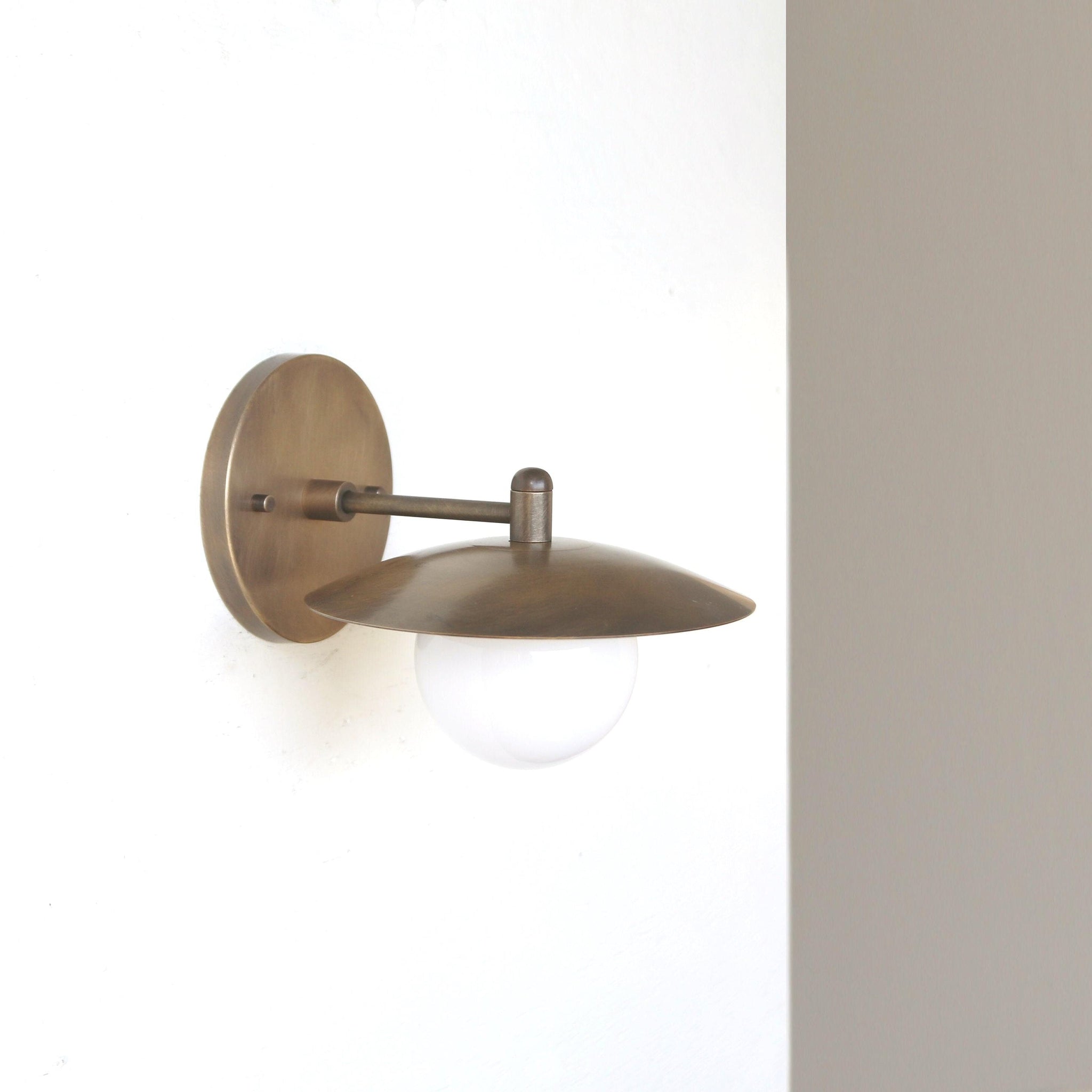 One-Light Brass Disc Shade Wall Sconce with Opal Globe