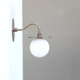 One-Light Brass Disc Wall Sconce with Opal Globe